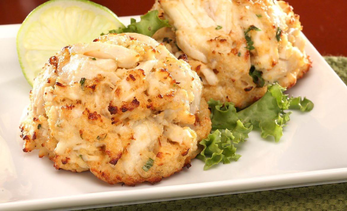 Crab cake with lime and greens